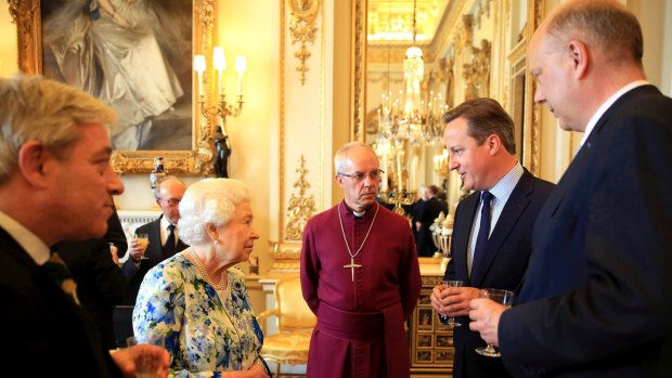 Calling Nigeria corrupt: Prime Minister David Cameron speaks with the Queen as the Archbishop of Canterbury Justin Welby looks on.