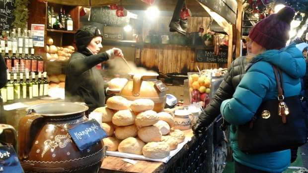 Hot food warms the hearts of some shoppers at the Budapest Christmas and New Year markets.