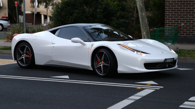 Auburn deputy mayor Salim Mehajer arrives for a council meeting in his white Ferrari.