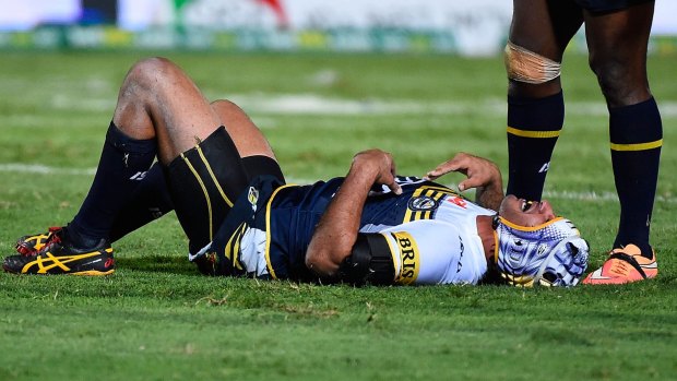 Laid out:  Johnathan Thurston gets his breath back after a late tackle.