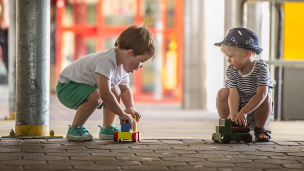 Two-year-olds Oliver Dawson and Louis Kane quickly made use of their wooden toys.