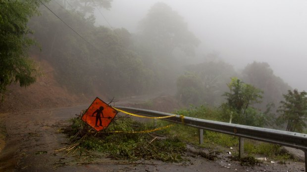 A washed out road in Alajuelita on the outskirts of San Jose, Costa Rica after Nate caused wide spread destruction.