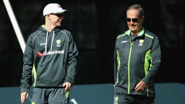 Recovery: Chris Rogers  and Australian team doctor Peter Brukner during  the tour match in Derbyshire.