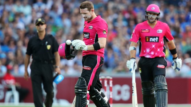 Close call: Riki Wessels of the Sydney Sixers takes off his helmet after a ball bowled by Kane Richardson hit him and got stuck in the visor of his helmet.
