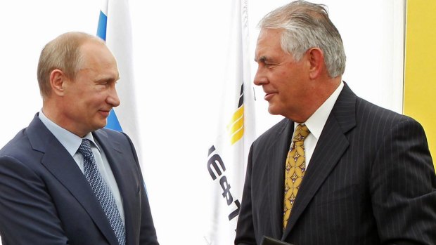 Mr Putin, left, and ExxonMobil chief executive Rex Tillerson.