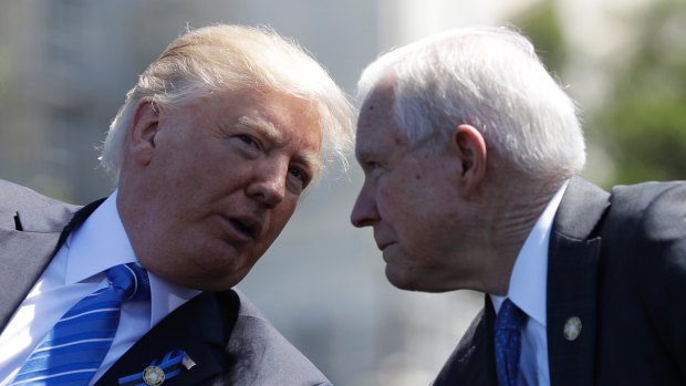 US President Donald Trump talks with Attorney-General Jeff Sessions early in May.