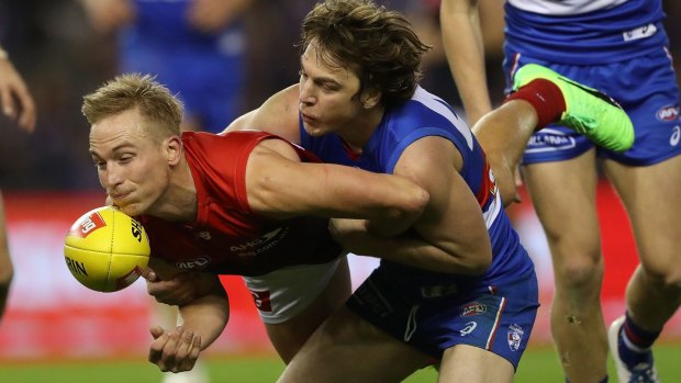 Free choice: Melbourne's Bernie Vince is dispossessed by Liam Picken.