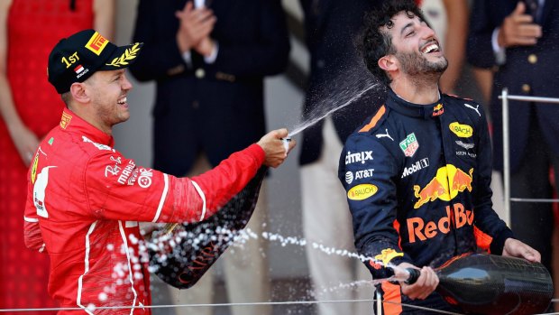 MONTE-CARLO, MONACO - MAY 28: Race winner Sebastian Vettel of Germany and Ferrari celebrates with third place finished Daniel Ricciardo of Australia and Red Bull Racing on the podium during the Monaco Formula One Grand Prix at Circuit de Monaco on May 28, 2017 in Monte-Carlo, Monaco. (Photo by Mark Thompson/Getty Images) ***BESTPIX***