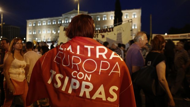 Protesters stage a rally in support of the government at Syntagma square in front of the Greek parliament building in Athens on Sunday