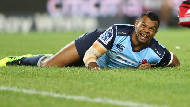 Devastating blow: Kurtley Beale looks to the sideline after injuring his knee.