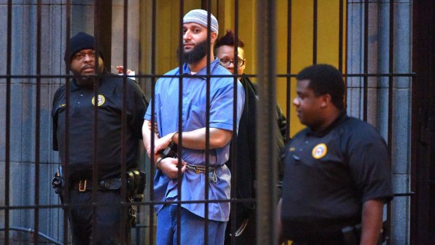 Retrial ordered ... Adnan Syed is escorted from a Baltimore court.