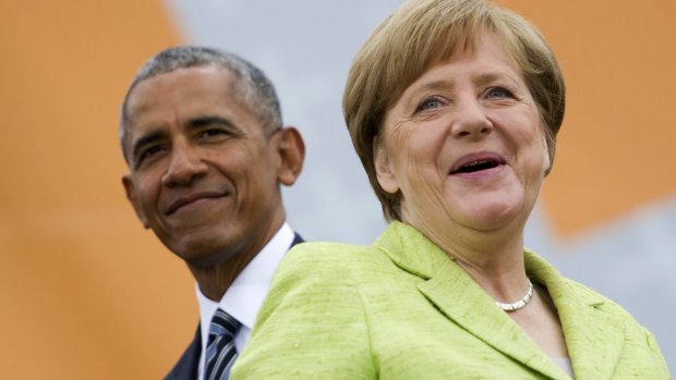 German Chancellor Angela Merkel and former US president  Barack Obama in Berlin on Thursday.