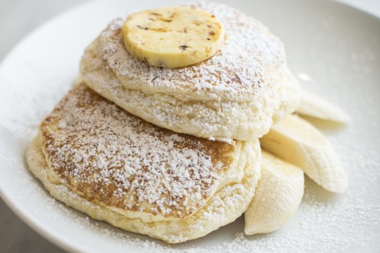 Ricotta hotcakes with banana and honeycomb butter.