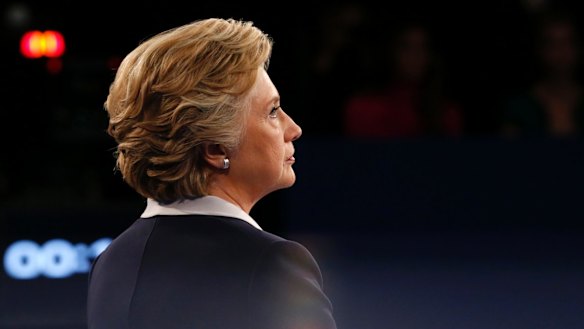 Hillary Clinton calmly watches as Republican presidential nominee Donald Trump speaks.