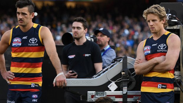 Came up short: Disappointed Crows skipper Taylor Walker and midfield star Rory Sloane. Walker was criticised for his performance in the grand final. 