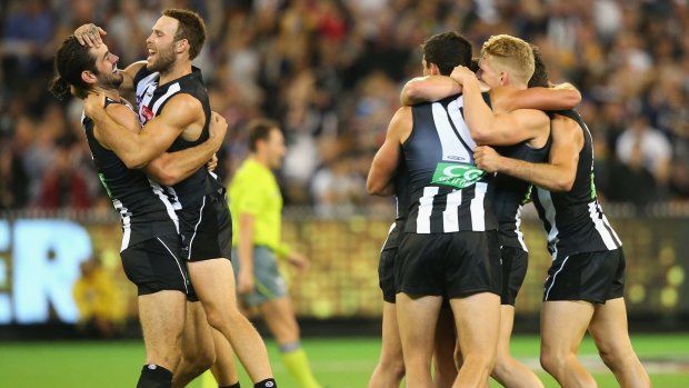 Brodie Grundy, Brent Macaffer, Adam Treloar, Taylor Adams and Scott Pendlebury of the Magpies celebrate after Grundy kicked the winning goal in round two against Richmond.