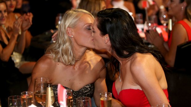 Sealed with a kiss: Erin Phillips is congratulated by wife Tracy.