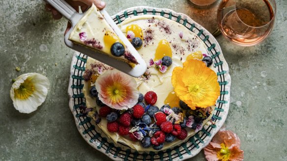 Ice and then decorate this cake with flowers and berries of your choice.
