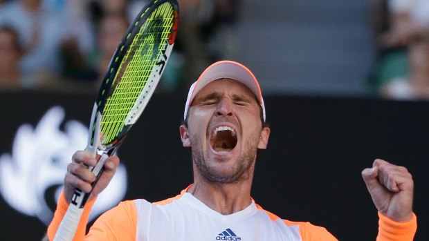 Mischa Zverev celebrates defeating Andy Murray in their fourth round match at the Australian Open tennis championships in Melbourne.