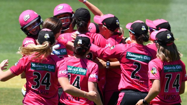 Title moment: The Sydney Sixers celebrate winning after the final of the Women's Big Bash League.