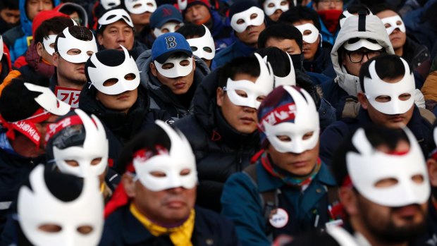 South Korean protesters attend an anti-government rally in downtown Seoul.