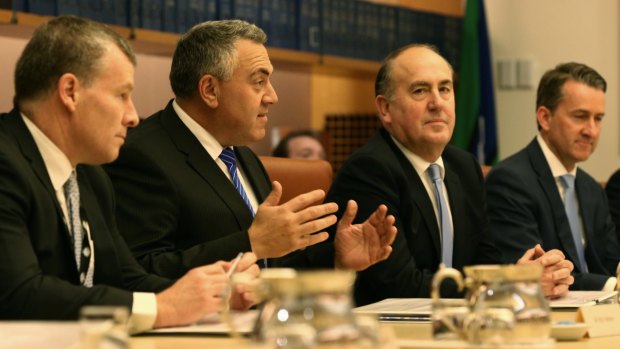Treasurer Joe Hockey, at centre) met with state and territory Treasurers to announce the new policy.