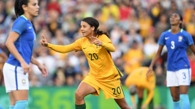 Sam Kerr scores with a glancing header against Brazil.