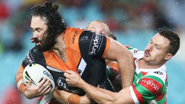 "We tried to look after him": Aaron Woods of the Tigers is tackled.
