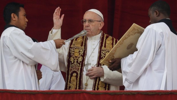 Pope Francis delivers the Urbi et Orbi (Latin for ' to the city and to the world' ) Christmas' day blessing.