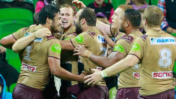 Nice one: David Williams of the Sea Eagles is congratulated by his teammates after scoring.
