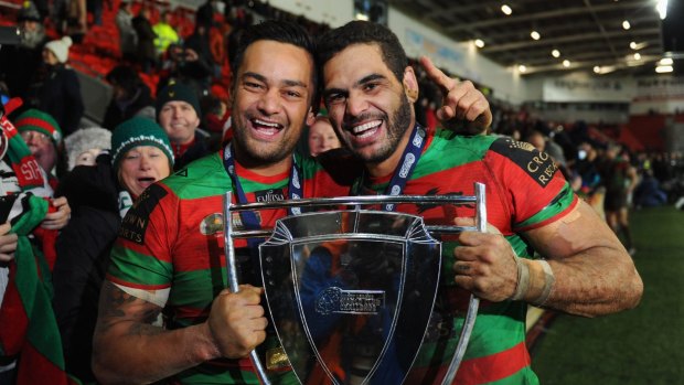 Bouncing back: John Sutton and Greg Inglis celebrate South Sydney's win over St Helens.