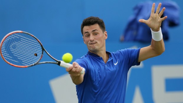 Bernard Tomic in action during his Queen's Club semi-final against Canadian Milos Raonic.  