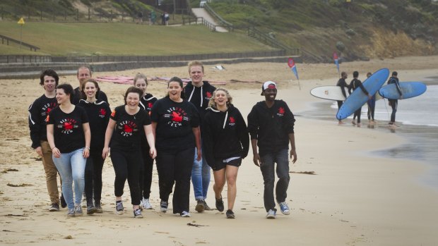 Brianna van't Hag (fifth from left), and her friends, pictured on the beach at Torquay, are among hundreds of young people volunteering as Red Frogs at Victorian schoolies which starts next week. 