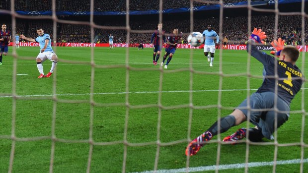 Barcelona goalkeeper Marc-Andre ter Stegen saves Sergio Aguero's penalty.