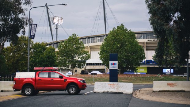 Concrete bollards and a car parked to block road access outside Canberra Stadium to increase security.