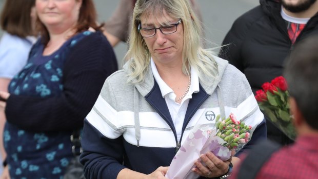 People arrive with floral tributes after the murder of Jo Cox.