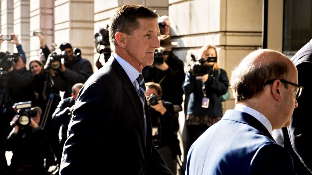 Michael Flynn arrives at the US Courthouse where he pleaded guilty on Friday to making false statements to the FBI.