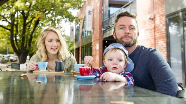 Damien Maher with his wife, Emma, and son, Harry, in Braddon.