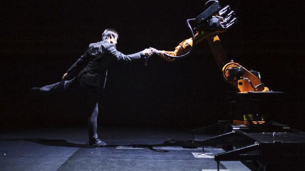 Taiwanese dancer and choreographer Huang Yi  performs a duet with KUKA the robot.
