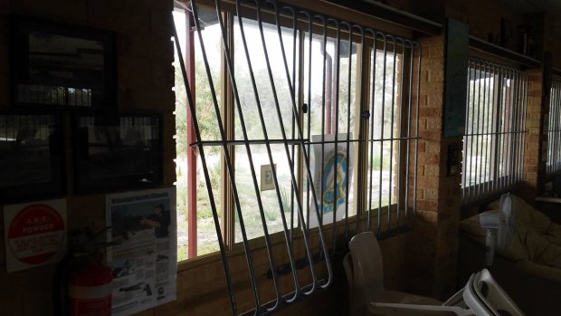 Vandals accessed the club house by forcing window gratings.
