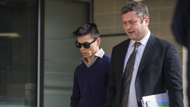 Stanley Hou, left, outside the ACT Magistrates Court in August with his lawyer Kamy Saeedi, right.