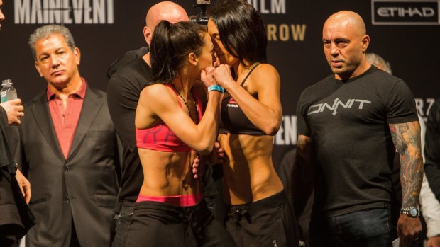 Joanna Jedrzejczyk (l) and Valerie Letourneau (r) during their weigh-in.