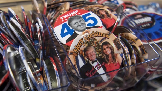 Pressing buttons: Presidential inauguration souvenirs on sale at the White House.