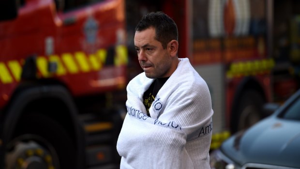 A Spitiko employee, believed to be a chef, is seen outside the restaurant on Wednesday afternoon.