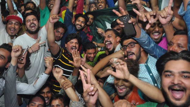 Win around the world: Pakistani cricket fans celebrate their team's victory in the Champions Trophy final against India, at a street in Lahore, Pakistan.