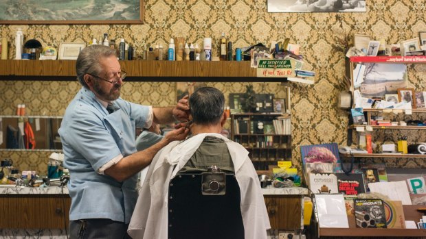 Barber Angelo Perri and his brother Tony, in their barber shop, Paris Style Hairdresser, in Cabramatta which they have run for more than 50 years. 