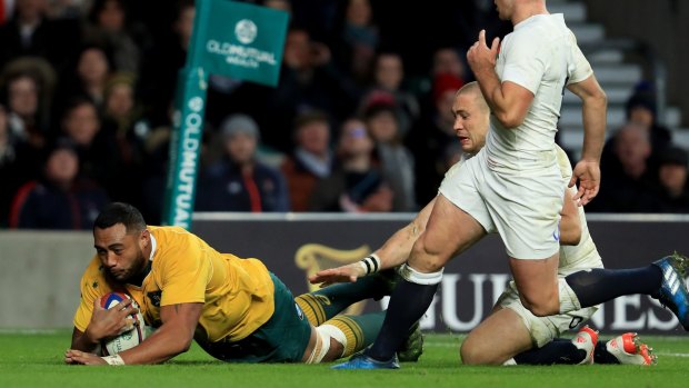 The Wallabies' Sekope Kepu breaks away to score.