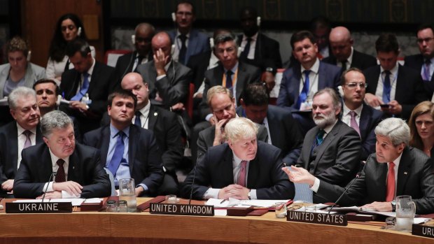 US Secretary of State John Kerry, right, speaks as Ukraine President Petro Poroshenko, left, and British Foreign Secretary Boris Johnson, centre, listen during a Security Council meeting, last week.