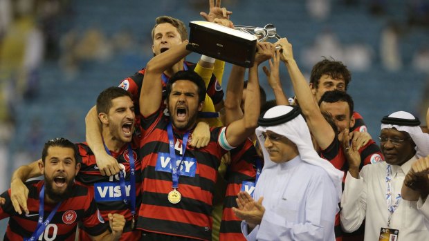 Greatest moment: Nikolai Topor-Stanley holds aloft the AFC Champions League trophy after leading the Wanderers to victory. 