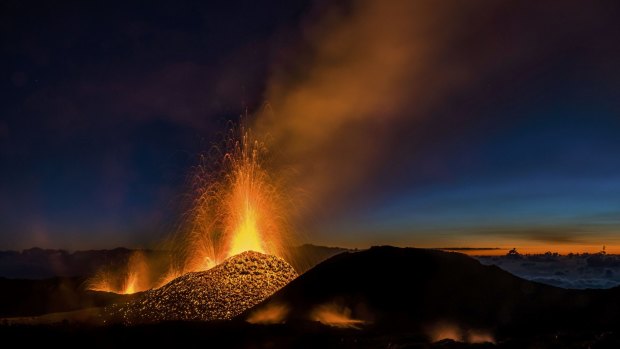 Molten lava erupts from the Piton de la Fournaise, one of the world's most active volcanoes, on Saturday.